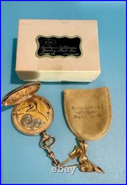 Vintage Elgin pocket watch with ornate case & bow fob early 1900s collectible
