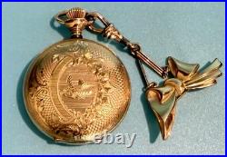 Vintage Elgin pocket watch with ornate case & bow fob early 1900s collectible